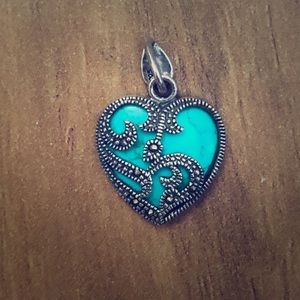 Jade and silver heart-shaped pendant.